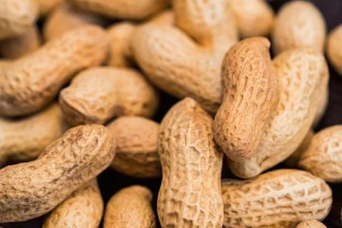 Close up unpeeled peanuts for background image Foto stock