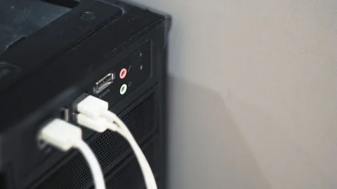 Close-up unplug headphone jack to black computer Stock Footage 101373172