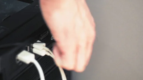 Close-up unplug headphone jack from black computer Видео 101373190