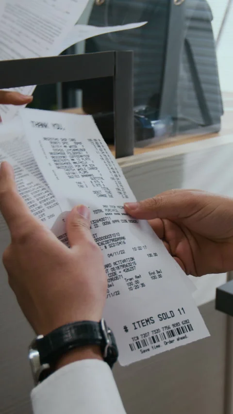 Close-up of Unrecognizable Bank Teller Examining Receipts Stock Footage 310117302