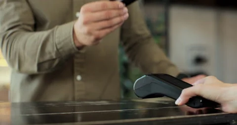 Close-up of unrecognizable caucasian man using credit card contactless payment Видео 159563179
