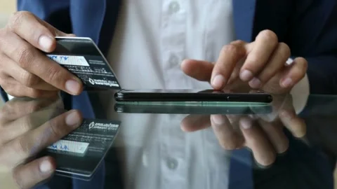 Close-up of unrecognizable caucasian man using credit card contactless paymen Stock Footage 266213133