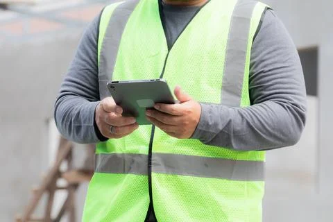 Close-up unrecognizable construction project foreman inspects construction .. Stock Photos