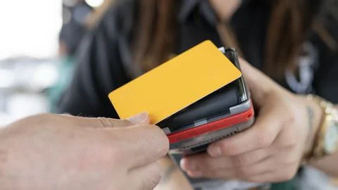 Close up of unrecognizable customer doing a contactless payment Stock Photos