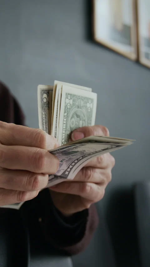 Close-up of Unrecognizable Hands Counting Stack of American Dollars Stock Footage 310114923