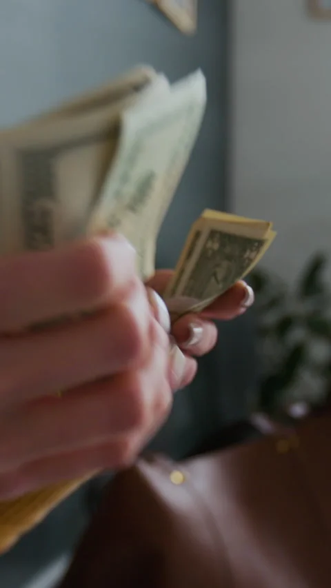 Close-up of Unrecognizable Hands Counting Stack of Cash Stock Footage 310115623