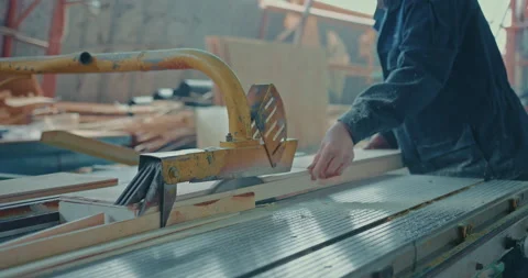 Close-up of an unrecognizable male carpenter in work clothes who works at a 스톡 동영상 226418119