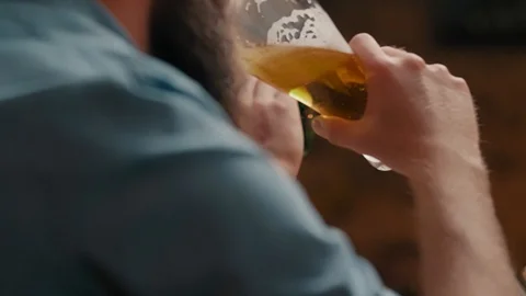 Close up of unrecognizable man drinking beer Stock Footage 108309392