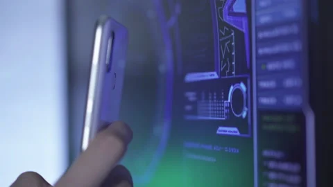 Close-up of unrecognizable man scanning computer screen with smartphone. Young Stock Footage 141955287
