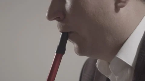 Close-up of unrecognizable man smoking hookah. Side view of young Caucasian guy Stock Footage 131080194
