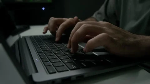 Close-up of Unrecognizable Man Typing Fast on Laptop Keyboard at Desk Stock Footage 302194884