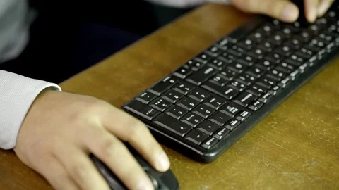 Close up of a Unrecognizable Man typing at his desk, office job Stock Footage 275349959
