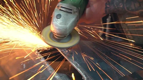 Close-up unrecognizable master hands grinding hole edges of car body metal part Stock-Footage 275399664