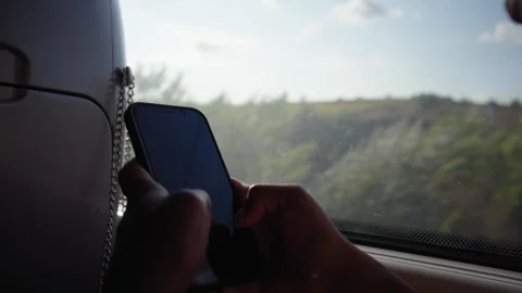Close up of Unrecognizable passenger using and typing mobile phone while Stock Footage 271073485