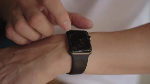 Close-up of unrecognizable person interacting with smart device on wrist Stock Footage 323207234