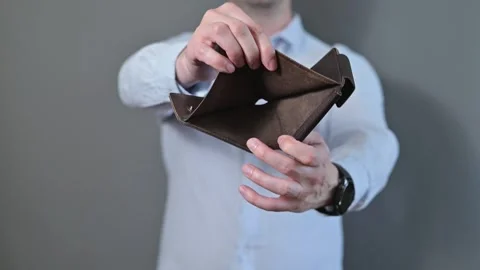 Close-up of an unrecognizable person showing an empty wallet Stock Footage 338300109