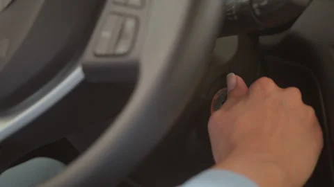 Close up unrecognizable woman hand inserting automobile key ignition lock turn Stock Footage 289341966