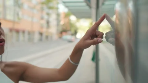 Close-up of unrecognizable woman's hand swipe finger on public transport Stock Footage 226535179
