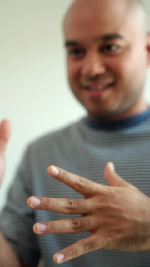 Close up of unrecognized deaf man fingers and hands showing sign language for co Stock-Footage 299847919