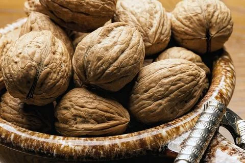 Close up of unshelled walnuts. Stock Photos