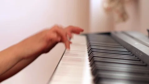 Close uo child's hand playing piano at home,right up piano Stock Footage 127923016