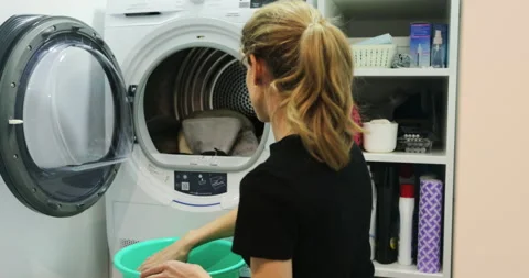 Close uo of female loading washing machine. Load clothes laundry washing machine 스톡 동영상 171824958