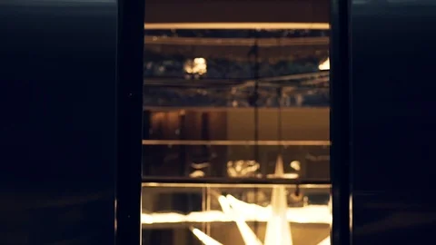 Close upelevator door opens shot back girl leaves lift and go to big hall Stock Footage 99694446