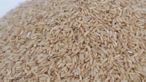 Close upper view of brown rice placed on a plate, Brown rice plate view Video stock 147689153