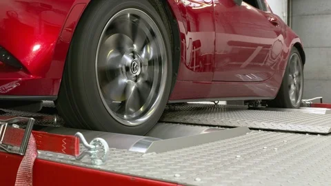 Close ups from a car on a rolling road or dynamometer. Being tested after 스톡 동영상 102872273