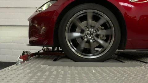 Close ups from a car on a rolling road or dynamometer. Being tested after 스톡 동영상 102872315