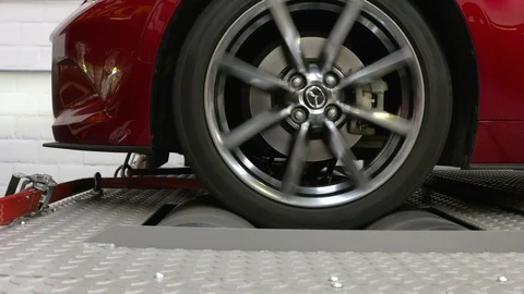 Close ups from a car on a rolling road or dynamometer. Being tested after 스톡 동영상 102872327
