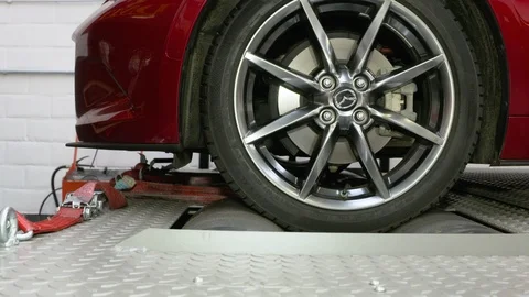 Close ups from a car on a rolling road or dynamometer. Being tested after 스톡 동영상 102873531