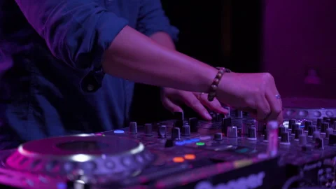 Close-ups, hands of the DJ who are mixing the music Stock Footage 154874794