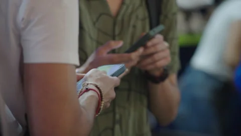 Close-ups of hands holding and using smartphones Stock Footage 325057297