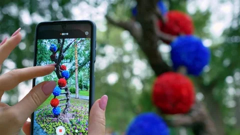 Close-ups show the capabilities of a smartphone for video and a photo camera, a Stock Footage 162341460