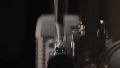 Close ups of a vintage 8MM projector spools moving and playing film Stock Footage 301843361