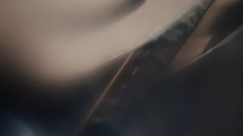 Close ups of a vintage 8MM projector spools moving and playing film Stock Footage 301844598