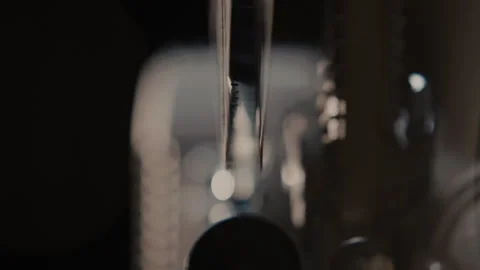 Close ups of a vintage 8MM projector spools moving and playing film Stock Footage 301844815