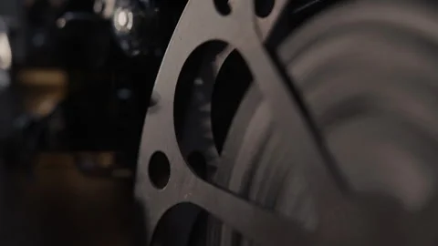 Close ups of a vintage 8MM projector spools moving and playing film Stock Footage 301845341