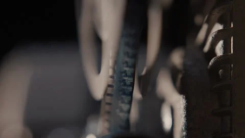 Close ups of a vintage 8MM projector spools moving and playing film Stock Footage 301846003