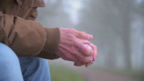 Close on Upset Elderly Man Holding Handkerchief Stock Footage 150970266