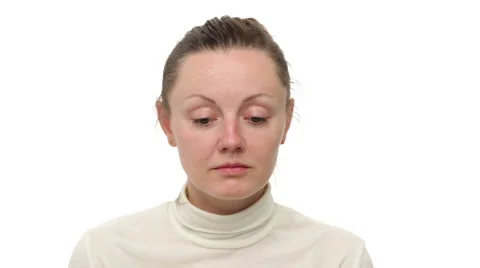 Close up upset woman's face, white background Stock Footage 64057697