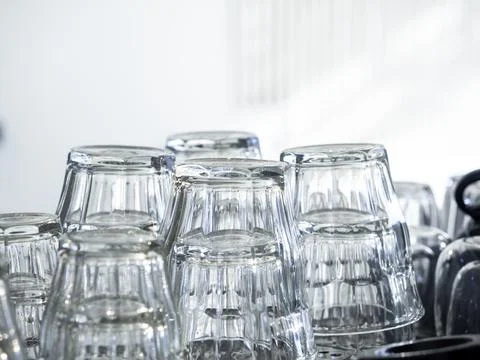 Close up upside down drinking water glasses. Foto stock