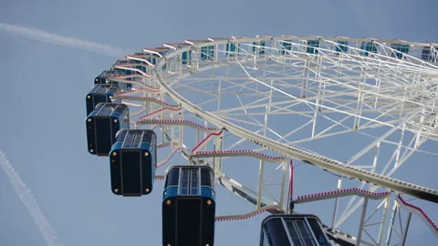 Close-up upward view of enclosed blue cabins following the curved rim Stock Footage 340333460