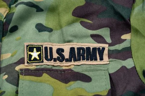 Close up of U.S. Army patch on camouflage military uniform Stock Photos