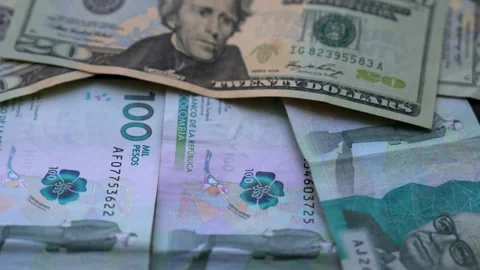 Close-up of US Dollar and Colombian Peso Currency Exchange Stock Footage 321423219