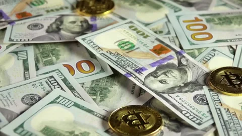Close-up of US dollar bills and Bitcoin coins Видео 328286389