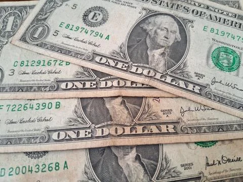 Close-up of US dollar bills with Benjamin Franklin. Financial currency and cash Stock Photos