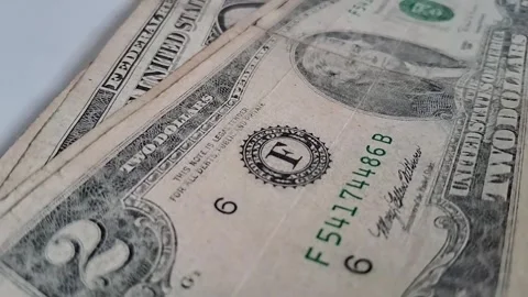 Close-up of US dollar bills, financial transaction or cash handling. Business Stock Footage 340480626