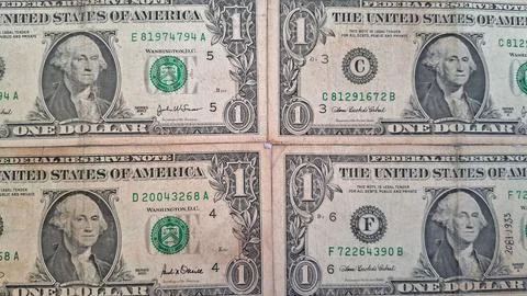 Close-up of US dollar bills with serial numbers. Financial documents and Stock Photos